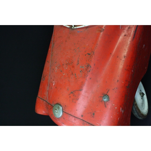 231 - Sharna Triang metal pedal car in red with white grill and hubs, mid 20th C, shows rusting