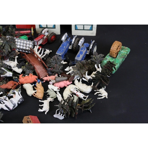 344 - Collection of plastic farmyard animals along with some diecast accessories & wooden buildings