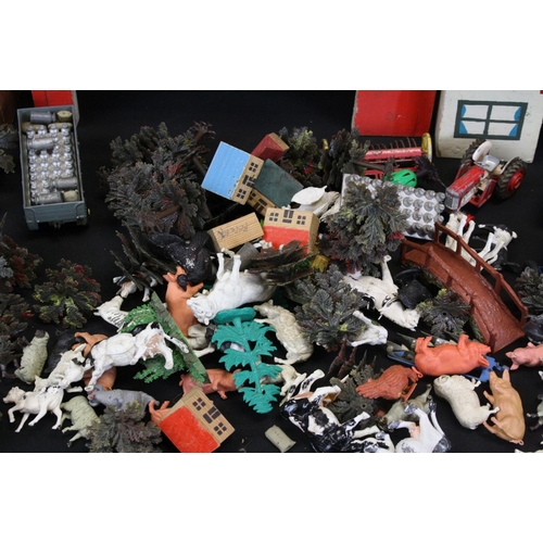 344 - Collection of plastic farmyard animals along with some diecast accessories & wooden buildings