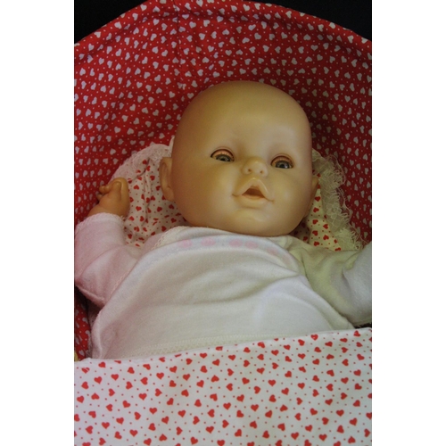 446 - Zapf Creation plastic baby doll with sleeping eyes, in a Moses basket, together with a further plast... 