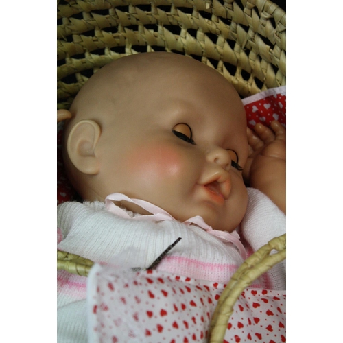 446 - Zapf Creation plastic baby doll with sleeping eyes, in a Moses basket, together with a further plast... 