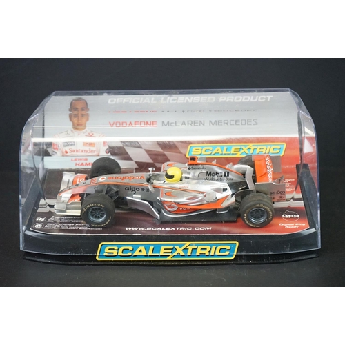 1283A - Two cased slot cars to include Scalextric C2865 McLaren MP4-21 Lewis Hamilton No.22 and Carrera Evol... 