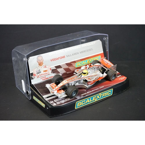 1283A - Two cased slot cars to include Scalextric C2865 McLaren MP4-21 Lewis Hamilton No.22 and Carrera Evol... 