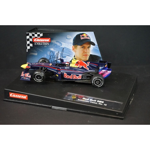 1283A - Two cased slot cars to include Scalextric C2865 McLaren MP4-21 Lewis Hamilton No.22 and Carrera Evol... 