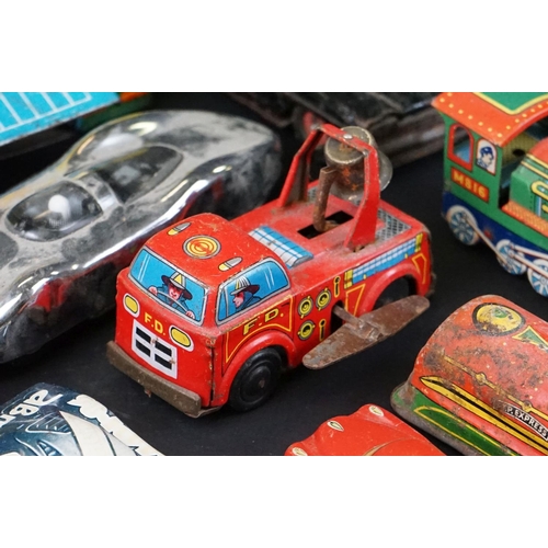 1287 - Over 30 play worn tin plate models, mid 20th C onwards, to include a Modern Toys Space Patrol vehicl... 