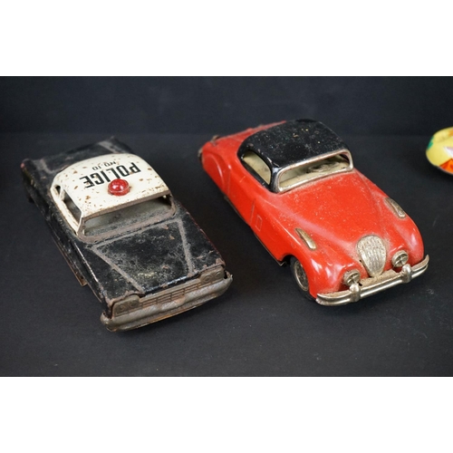 1287 - Over 30 play worn tin plate models, mid 20th C onwards, to include a Modern Toys Space Patrol vehicl... 