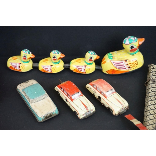 1287 - Over 30 play worn tin plate models, mid 20th C onwards, to include a Modern Toys Space Patrol vehicl... 