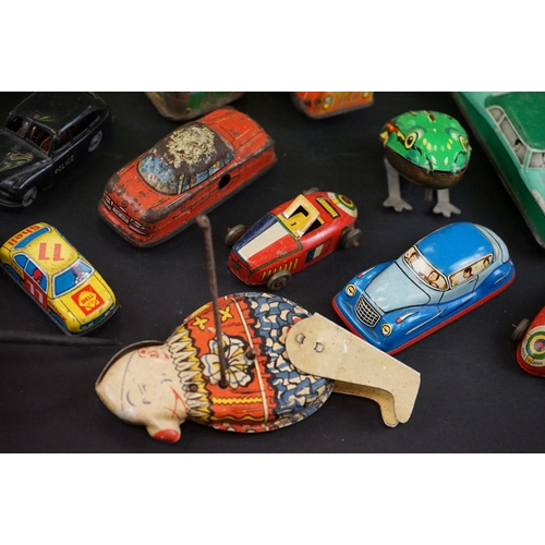 1287 - Over 30 play worn tin plate models, mid 20th C onwards, to include a Modern Toys Space Patrol vehicl... 