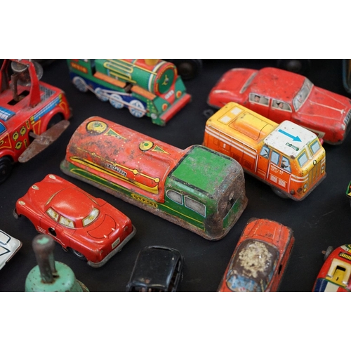 1287 - Over 30 play worn tin plate models, mid 20th C onwards, to include a Modern Toys Space Patrol vehicl... 