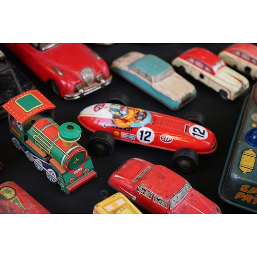 1287 - Over 30 play worn tin plate models, mid 20th C onwards, to include a Modern Toys Space Patrol vehicl... 