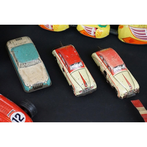 1287 - Over 30 play worn tin plate models, mid 20th C onwards, to include a Modern Toys Space Patrol vehicl... 