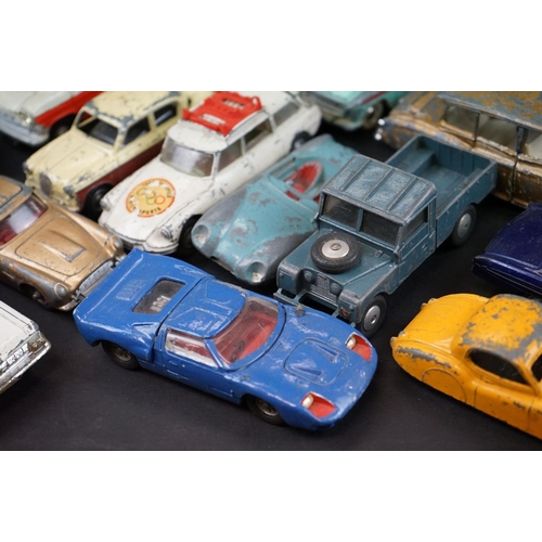 1293A - Over 40 mid 20th C play worn diecast models to include Dinky, Corgi, Matchbox, Britains and Budgie e... 