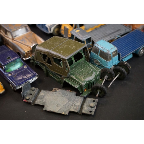 1293A - Over 40 mid 20th C play worn diecast models to include Dinky, Corgi, Matchbox, Britains and Budgie e... 