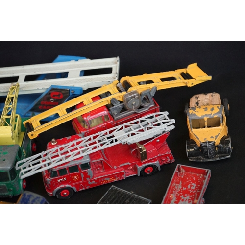 1293A - Over 40 mid 20th C play worn diecast models to include Dinky, Corgi, Matchbox, Britains and Budgie e... 