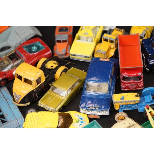 1293B - Around 65 mostly mid 20th C play worn diecast models to include Dinky, Corgi, Budgie and Matchbox ex... 