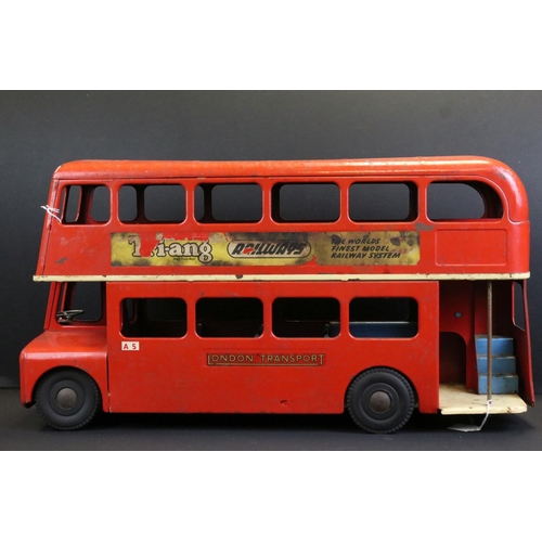 289 - Original Triang tin plate London Transport Routemaster bus with 'Putney Bridge Station' decals, show... 