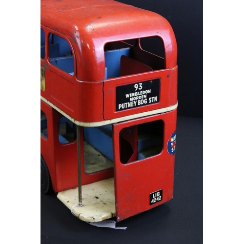 289 - Original Triang tin plate London Transport Routemaster bus with 'Putney Bridge Station' decals, show... 