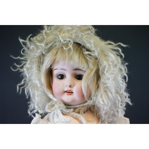 404 - Early 20th C Heubach Koppelsdorf doll with sleeping blue eyes, teeth and original outfit featuring r... 