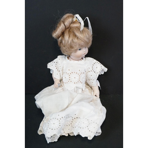 404 - Early 20th C Heubach Koppelsdorf doll with sleeping blue eyes, teeth and original outfit featuring r... 