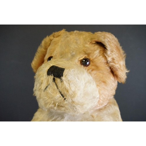 411 - Three vintage soft toys to include straw filled dog with zipper back, hand puppet and another