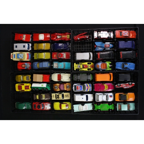 1104 - Three Matchbox 1980s plastic carry cases containing 63 diecast models, mostly Matchbox examples, fea... 