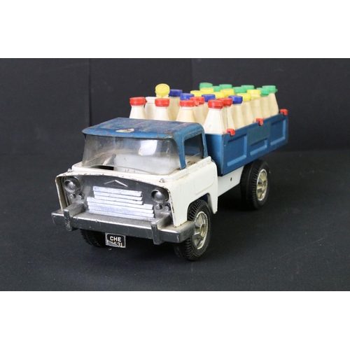 287 - Five Triang tinplate vehicles to include circus truck, circus trailer (with one plastic camel), tipp... 