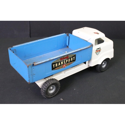 287 - Five Triang tinplate vehicles to include circus truck, circus trailer (with one plastic camel), tipp... 