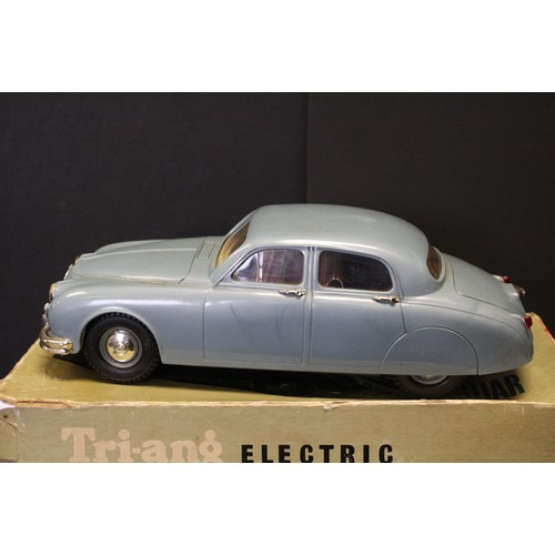 316A - Boxed Triang Battery-operated 2.4 Litre Jaguar, in blue, 1/20 scale (shows play wear; missing steeri... 