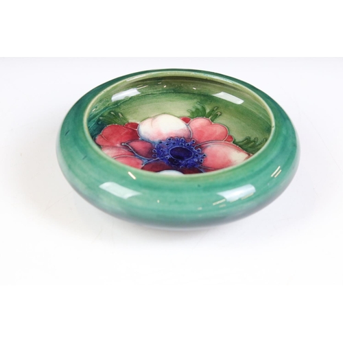 58 - Moorcroft - A William Moorcroft ' Hibiscus ' pattern ashtray together with an ' Anemone ' astray and... 
