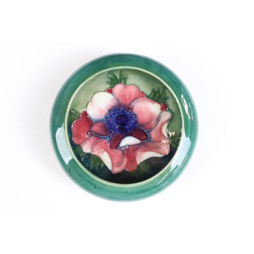 58 - Moorcroft - A William Moorcroft ' Hibiscus ' pattern ashtray together with an ' Anemone ' astray and... 