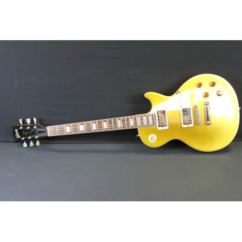 1153 - Guitar - A Les Paul style 'gold top' electric guitar with Gibson decals.  Comes with hard case