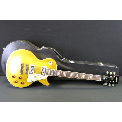 1152 - Guitar - A Les Paul style 'gold top' electric guitar with Gibson Decals.  Comes with hard case