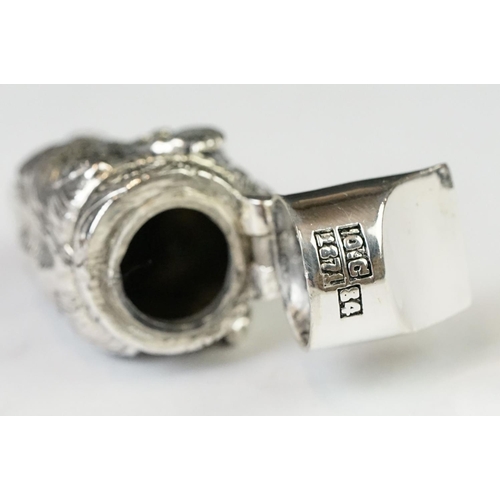 219 - A silver plated whistle and vesta case in the form of a boars head with ruby eyes