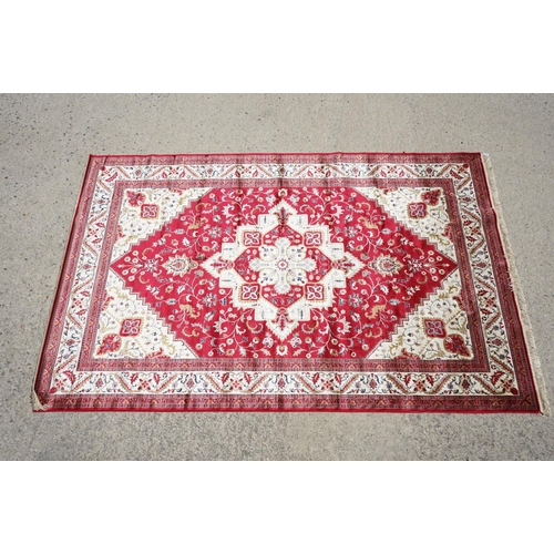 636 - Red Ground Full Pile Cashmere Carpet with medallion design, 300cmm x 200cm