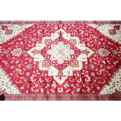 636 - Red Ground Full Pile Cashmere Carpet with medallion design, 300cmm x 200cm