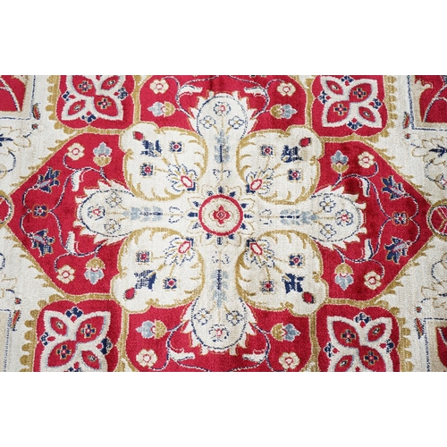 636 - Red Ground Full Pile Cashmere Carpet with medallion design, 300cmm x 200cm