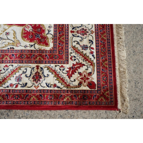 636 - Red Ground Full Pile Cashmere Carpet with medallion design, 300cmm x 200cm