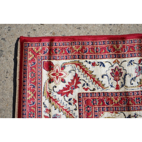 636 - Red Ground Full Pile Cashmere Carpet with medallion design, 300cmm x 200cm