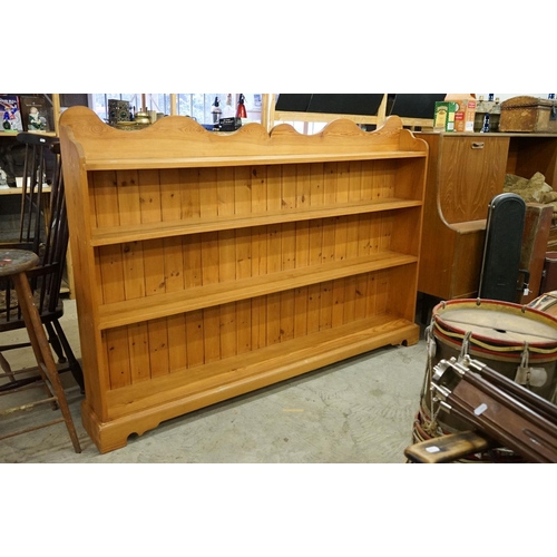 647 - Large 19th century style Pine Bookcase with shaped top rail and four shelves, 183cm long x 129cm hig... 