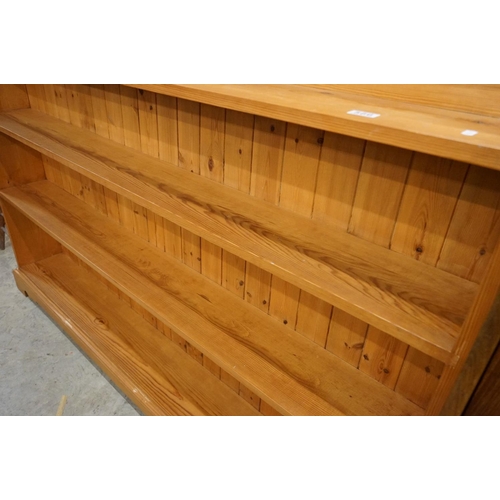 647 - Large 19th century style Pine Bookcase with shaped top rail and four shelves, 183cm long x 129cm hig... 