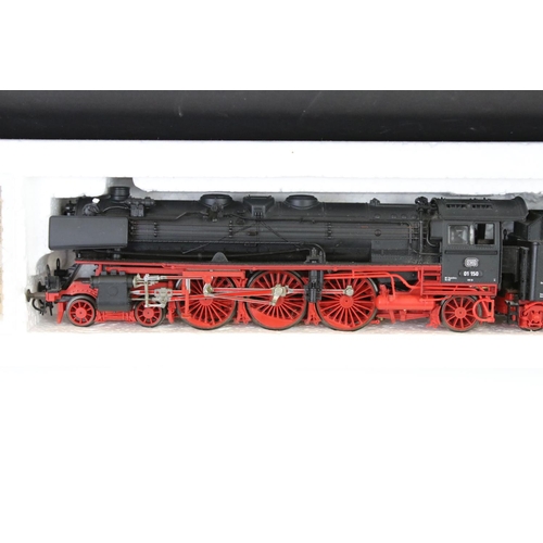 56 - Three boxed Roco HO gauge locomotives to include 43737 DRG E91 88, 43240 DB and a 2-10-0 DB with ten... 