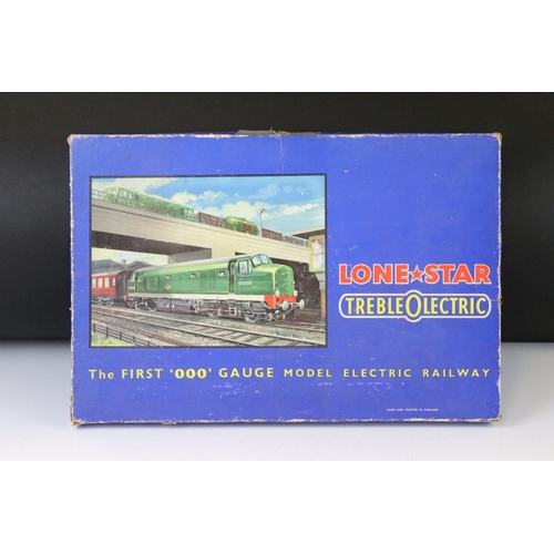 81 - Boxed Lone Star Treble OOO gauge train set complete with locomotive, 2 x rolling stock and track, wi... 