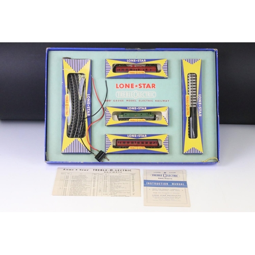 81 - Boxed Lone Star Treble OOO gauge train set complete with locomotive, 2 x rolling stock and track, wi... 