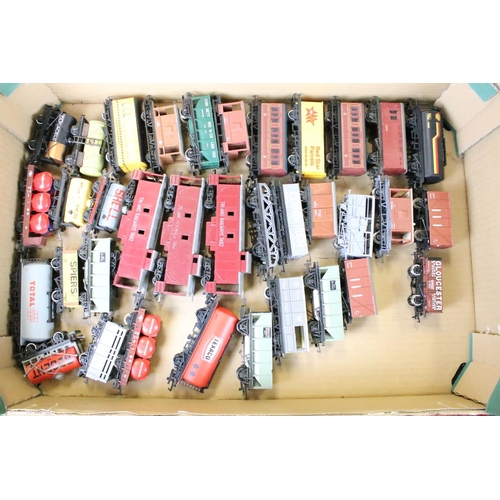 111 - Around 80 OO gauge items of rolling stock to include mainly Triang & Hornby examples featuring wagon... 