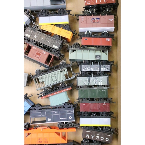 111 - Around 80 OO gauge items of rolling stock to include mainly Triang & Hornby examples featuring wagon... 