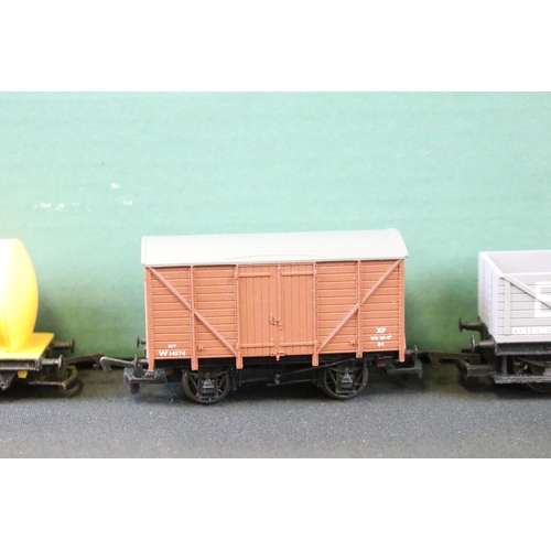 111 - Around 80 OO gauge items of rolling stock to include mainly Triang & Hornby examples featuring wagon... 