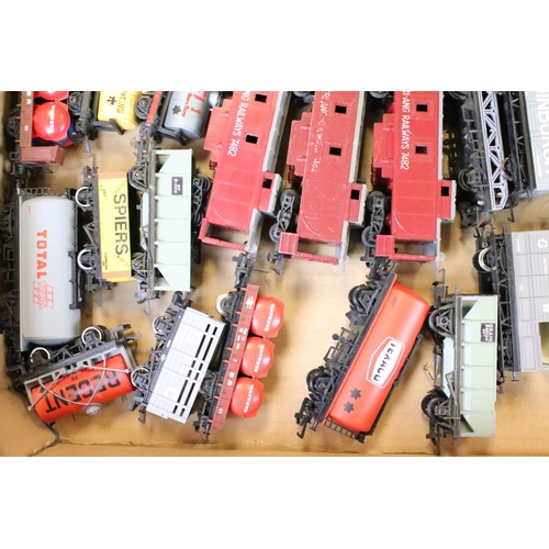 111 - Around 80 OO gauge items of rolling stock to include mainly Triang & Hornby examples featuring wagon... 