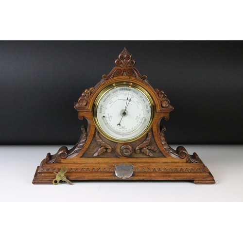 105 - Victorian Baroque Revival carved oak mantle barometer, with scrolling decoration, raised on a steppe... 