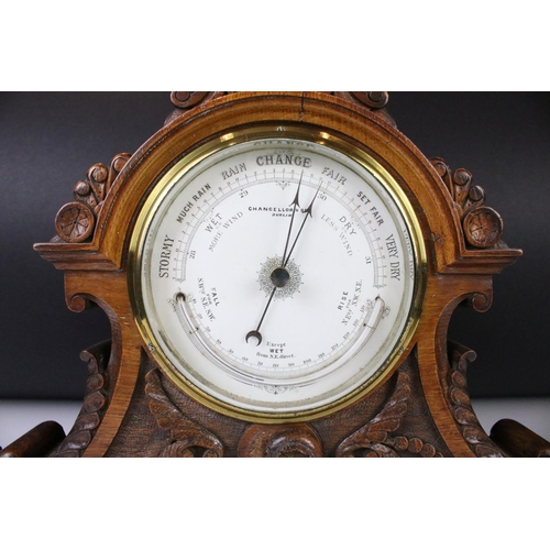 105 - Victorian Baroque Revival carved oak mantle barometer, with scrolling decoration, raised on a steppe... 