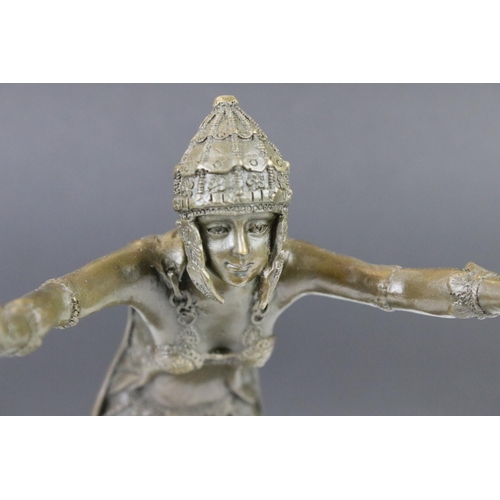 111 - A bronze art deco style figure signed standing on stepped marble base, 25.5cm high